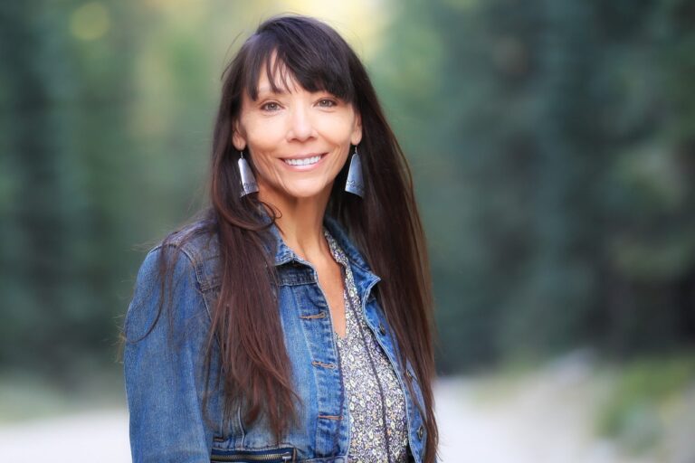 author cmarie fuhrman smiling for a photo outdoors