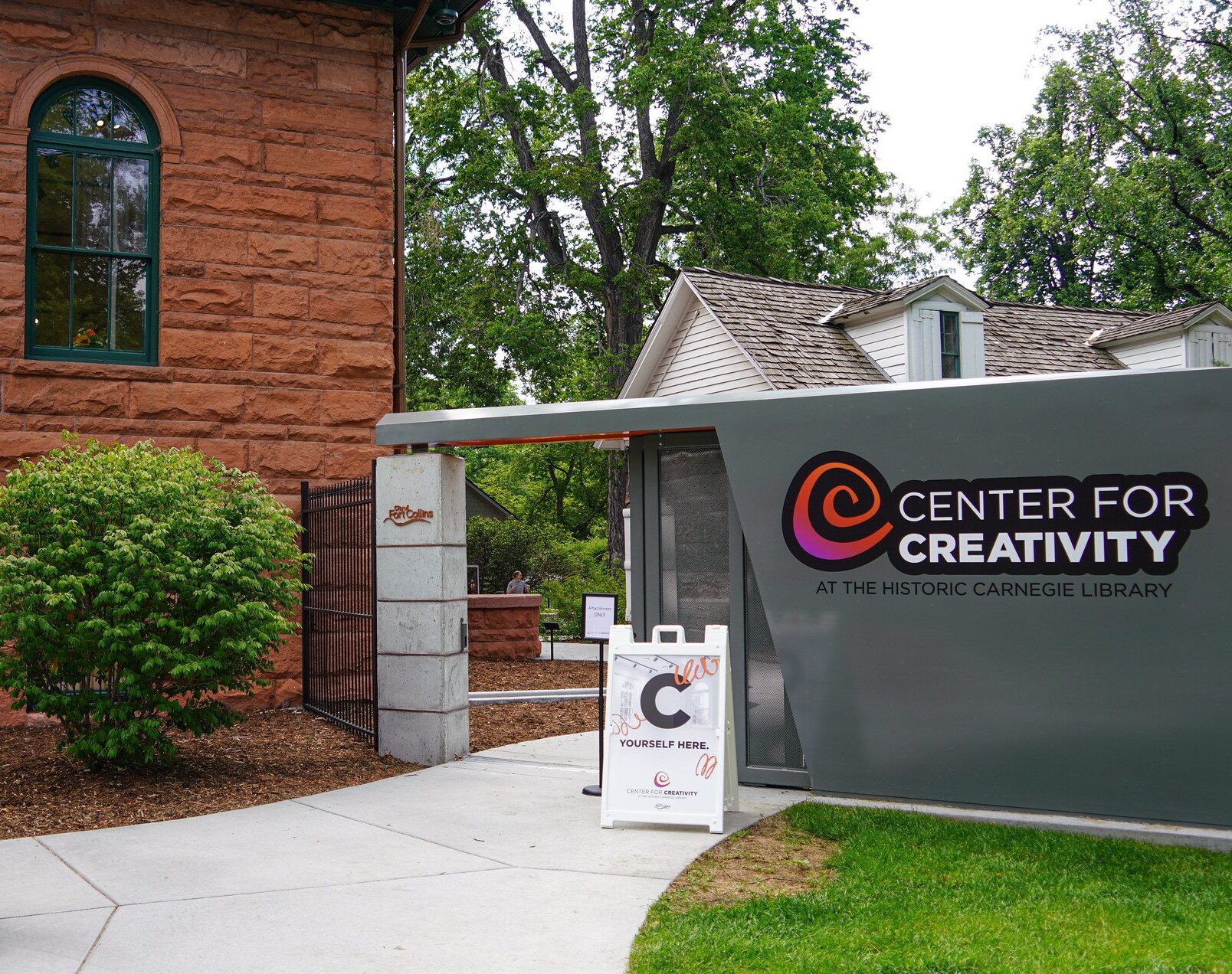 the redsandstone exterior and cate of the center for creativity in Fort Collins